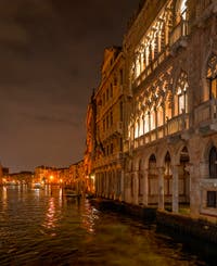 Venice by Night in November, the lace of the Ca' d'Oro Palace and the Venice Grand Canal.
