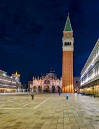 The Saint-Mark Square in Venice with the Bell Tower and the Basilica.