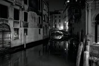 The San Zulian Canal reflections and the Balbi Bridge in Venice.