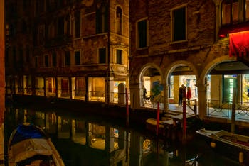 The Santi Apostoli Canal reflections and the del Magazen and Fallier Sotoporteghi in the Cannaregio District in Venice.