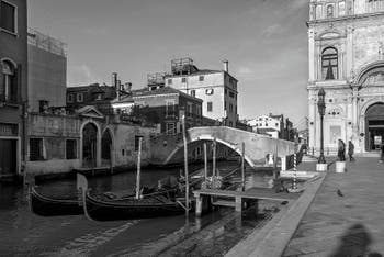 Gondolas on Mendicanti Canal in front of Cavallo Bridge in the Castello in Venice