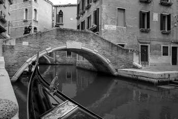 Gondola on the Miracoli Canal in front of the Santa Maria Nova Bridge in the Cannaregio district in Venice