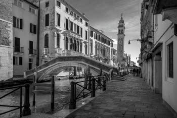 The Lion Bridge and San Lorenzo Bank with the Greci Bell Tower, in the Castello district in Venice