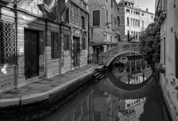 Perfect reflections in the Widmann Canal in the Cannaregio District in Venice.