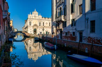 Beauty and Blue Sky: The Scuola Grande San Marco's reflections in the Castello District in Venice.
