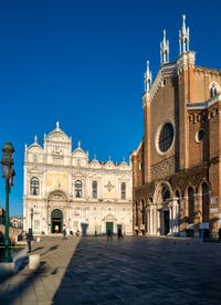 The Scuola Grande San Marco and the San Giovanni e Paolo Square and Basilica in the Castello District in Venice.