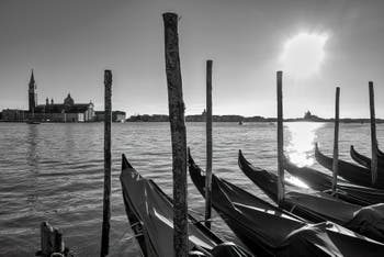 Saint Mark's Basin Gondolas and the San Giorgio Maggiore Island in Venice.