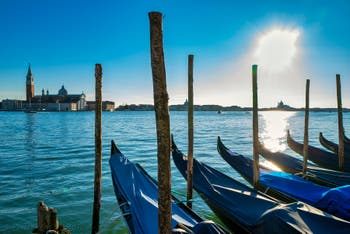 Saint Mark's Basin Gondolas and the San Giorgio Maggiore Island in Venice.