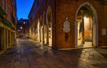 The Becarie Street and the Rialto Fish Market by night in the San Polo District in Venice.