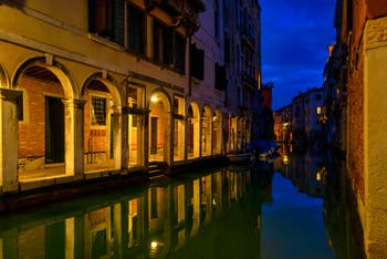 The mirror of the Santi Apostoli Canal and the Sotoportegho del Tragheto in the Cannaregio District in Venice.