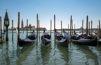 Gondolas at Saint-Mark in front of San Giorgio Maggiore Island in Venice