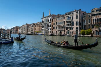 Gondolas on Venice Grand Canal in front of Papadopoli, Businello and Barzizza Palaces.