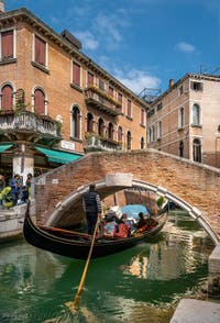 Gondola on the dei Miracoli Canal in front of the Santa Maria Nova Bridge in the Cannaregio district in Venice.