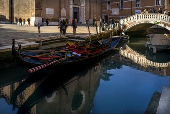 Gondolas in front of the dei Frari Bridge in the San Polo district in Venice.