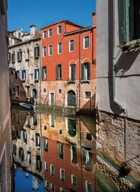 Venetian reflections on de la Madoneta Canal in San Polo district in Venice.