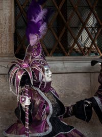 Venice Carnival 2022 Masks and Costumes in front of St. Mark Basin and the Doge's Palace