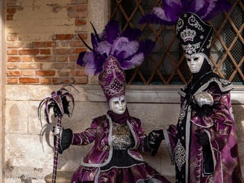 Venice Carnival 2022 Masks and Costumes in front of St. Mark Basin and the Doge's Palace