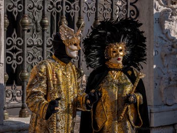 Costumes and Masks at the Venice Carnival, Prince and Princess of the Eagle in black and gold at the Arsenal.