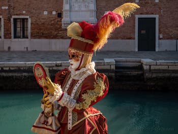 Costumes and Masks at the Venice Carnival, The Young Princess in the Mirror in Red and Gold at the Arsenal.