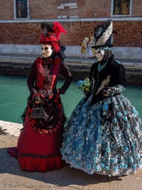 Costumes and Masks at the Venice Carnival, Beautiful Girls in Red, Blue and Black at the Arsenal.