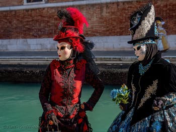 Costumes and Masks at the Venice Carnival, Beautiful Girls in Red, Blue and Black at the Arsenal.