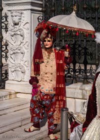 Indian Maharadja with a parasol at the Arsenal, the Masks and Costumes of the Venice Carnival.
