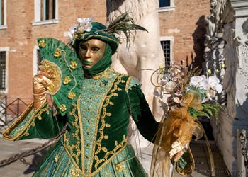 Graceful green lady blooming at the Arsenal, Venetian Carnival Masks and Costumes.