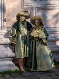 Nobility in gold and green at San Zaccaria, Venetian carnival masks and costumes
