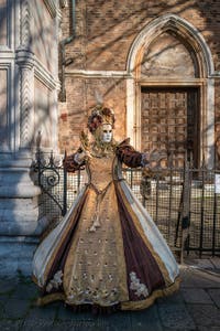 Venetian Carnival masks and costumes in pearls, feathers and gold at San Zaccaria