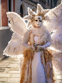 A costumed angel from the Venetian carnival on Campo Widmann in the Castello