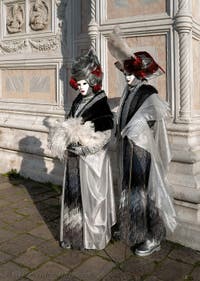 Venice carnival costumes in front of the church of San Zaccaria.