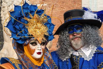 Venice Carnival costumes in front of the Venice Arsenale.