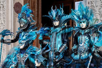 Venetian carnival costumed figures in front of the church of San Zaccaria.