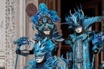 Venetian carnival costumed figures in front of the church of San Zaccaria.