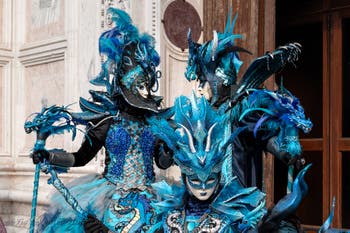 Venetian carnival costumed figures in front of the church of San Zaccaria.