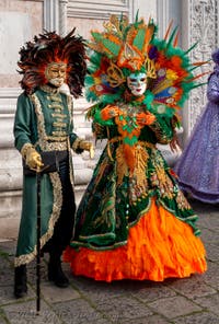 Venetian carnival costumed figures in front of the church of San Zaccaria.