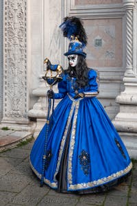 Venetian carnival costumed figures in front of the church of San Zaccaria.