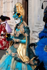 Venetian carnival costumed figures in front of the church of San Zaccaria.