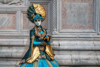 Venetian carnival costumed figures in front of the church of San Zaccaria.