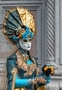 Venetian carnival costumed figures in front of the church of San Zaccaria.