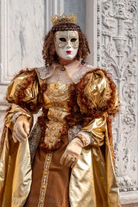 Venetian carnival costumed figures in front of the church of San Zaccaria.