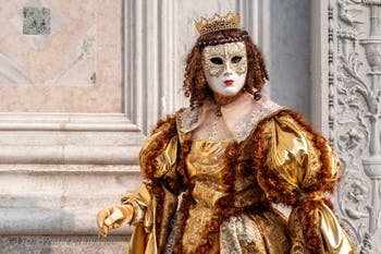 Venetian carnival costumed figures in front of the church of San Zaccaria.