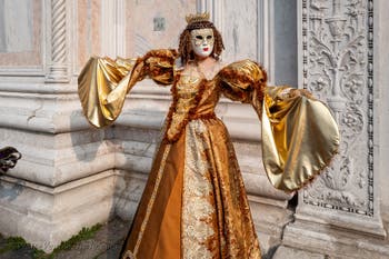 Venetian carnival costumed figures in front of the church of San Zaccaria.