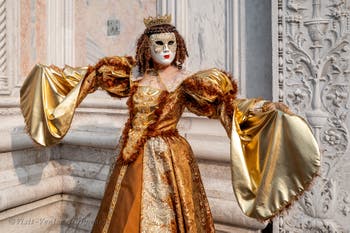 Venetian carnival costumed figures in front of the church of San Zaccaria.