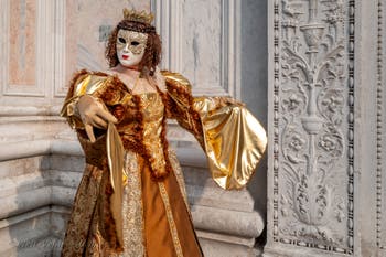 Venetian carnival costumed figures in front of the church of San Zaccaria.