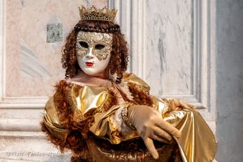 Venetian carnival costumed figures in front of the church of San Zaccaria.