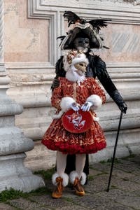 Venetian carnival costumed figures in front of the church of San Zaccaria.