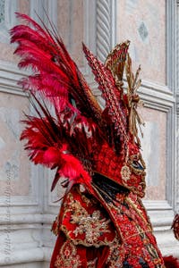 Venetian carnival costumed figures in front of the church of San Zaccaria.