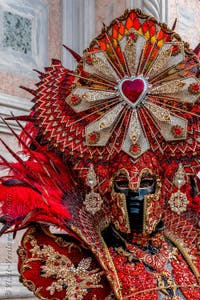 Venetian carnival costumed figures in front of the church of San Zaccaria.