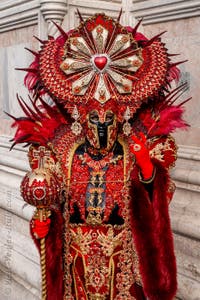 Venetian carnival costumed figures in front of the church of San Zaccaria.